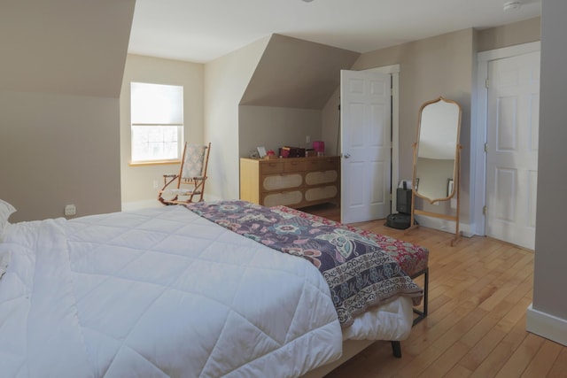 bedroom with wood finished floors