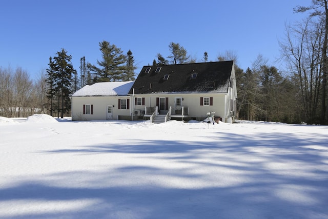 view of snow covered house