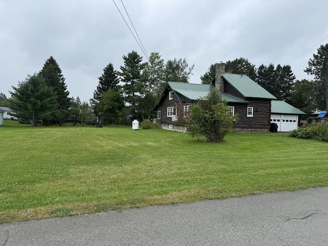 view of yard featuring an attached garage