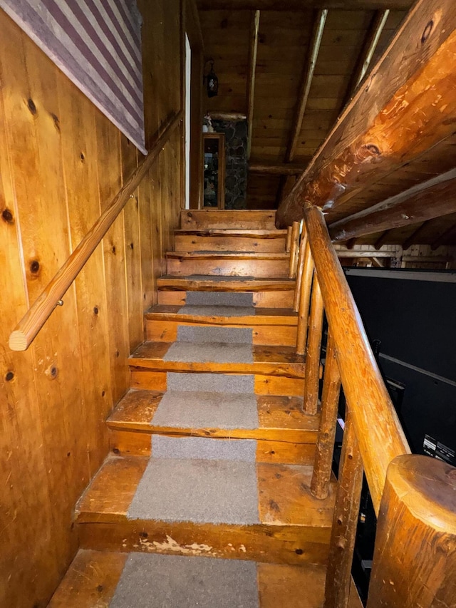 staircase with wooden walls