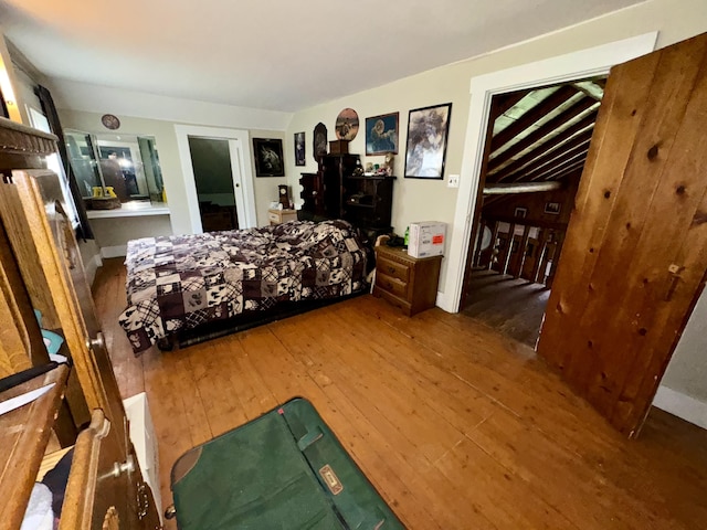 bedroom with hardwood / wood-style flooring