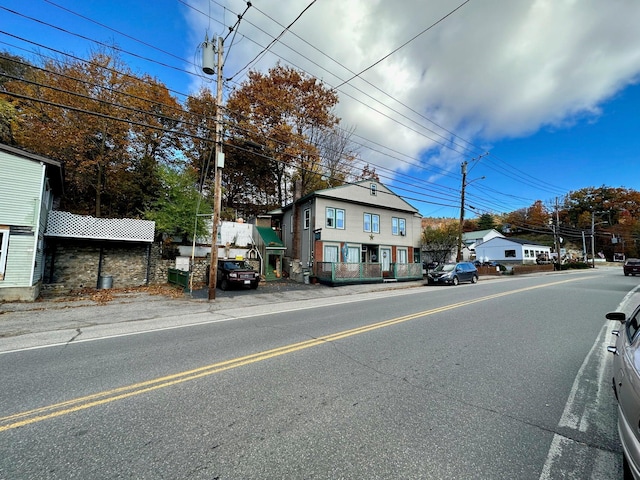 view of road with street lights and sidewalks