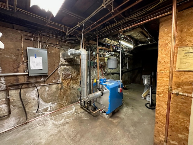 utility room with electric panel and a heating unit