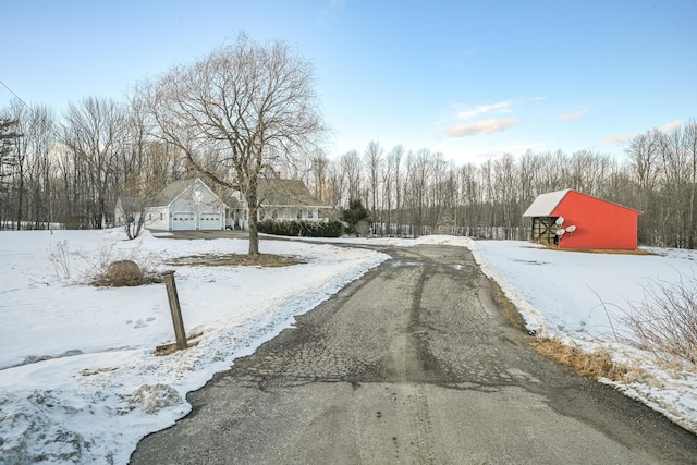 view of street featuring aphalt driveway