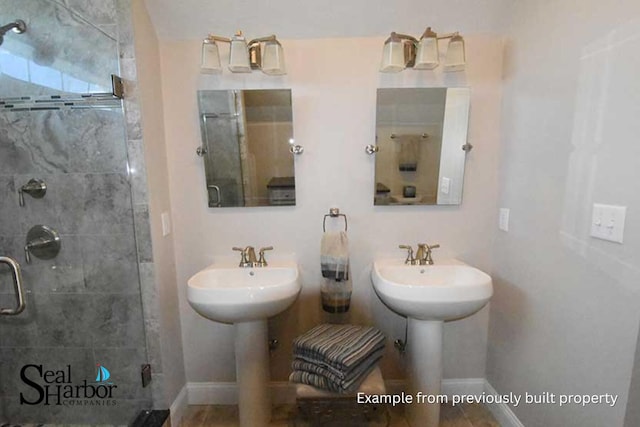 11 Clam Ln Unit A, Wells, ME 04090 - full bath featuring a stall shower, baseboards, and a sink