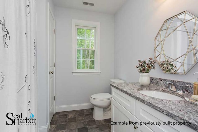 11 Clam Ln Unit A, Wells, ME 04090 - full bath with vanity, toilet, baseboards, and curtained shower