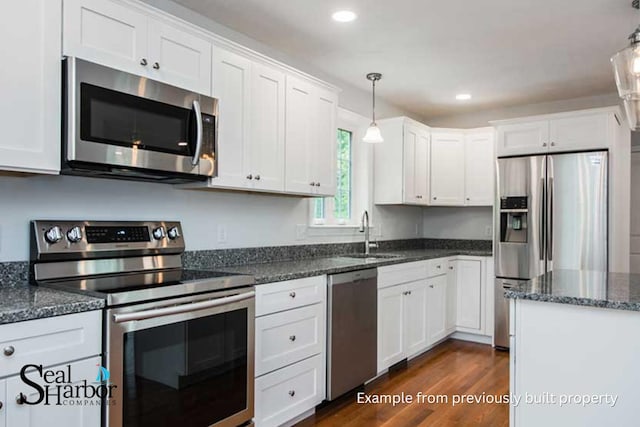 11 Clam Ln Unit A, Wells, ME 04090 - kitchen with appliances with stainless steel finishes, white cabinets, hanging light fixtures, and recessed lighting