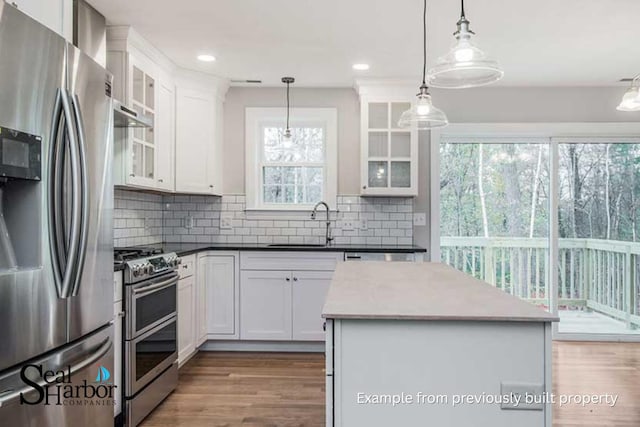 11 Clam Ln Unit A, Wells, ME 04090 - kitchen featuring appliances with stainless steel finishes, wood finished floors, a sink, white cabinetry, and recessed lighting