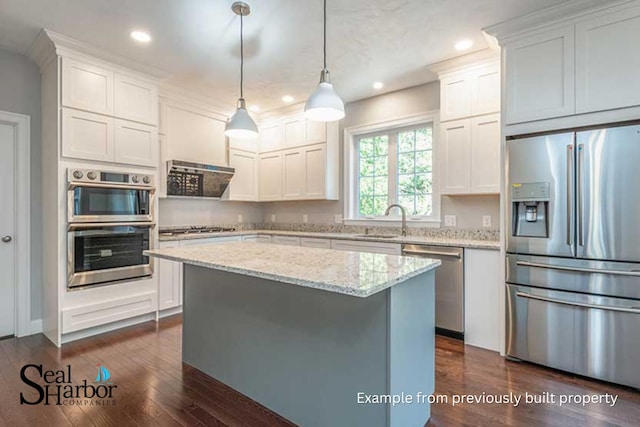 11 Clam Ln Unit A, Wells, ME 04090 - kitchen featuring appliances with stainless steel finishes, a sink, dark wood finished floors, recessed lighting, and a center island
