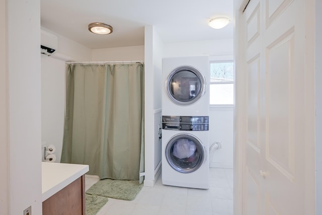 laundry room with laundry area and stacked washer / drying machine