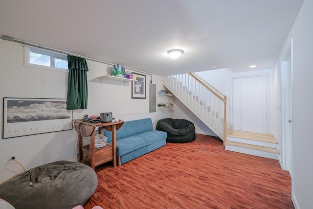 living room featuring stairway and wood finished floors