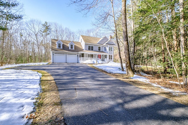 view of front of home featuring aphalt driveway and covered porch