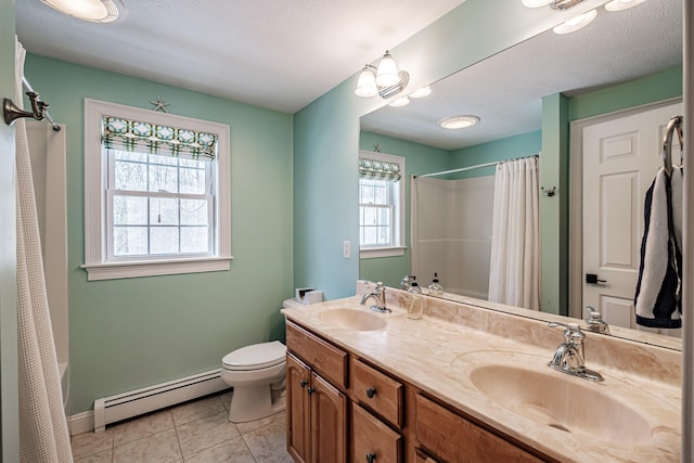 bathroom featuring tile patterned flooring, toilet, a baseboard heating unit, and a sink