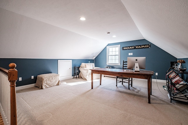 carpeted office featuring vaulted ceiling, baseboards, and a textured ceiling