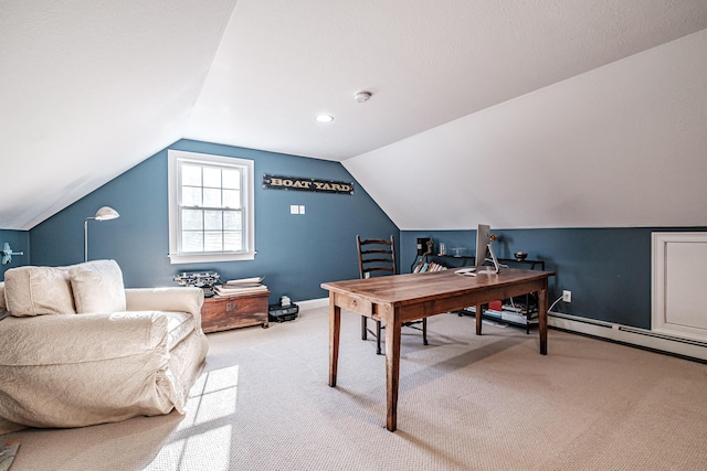 office space with light colored carpet, baseboards, and vaulted ceiling