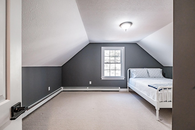 unfurnished bedroom featuring carpet, baseboards, vaulted ceiling, a textured ceiling, and a baseboard heating unit