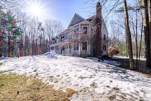 rear view of house with a porch