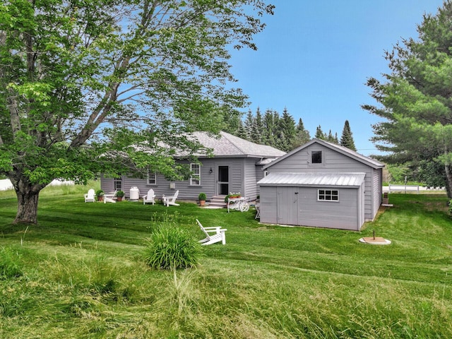 135 P Ridge Rd, Readfield, ME 04355 - back of property with entry steps and a yard
