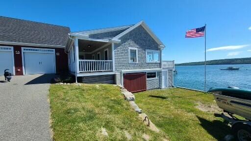 20 Wharf Rd, Blue Hill, ME 04614 - ranch-style house featuring a front yard, a water view, and asphalt driveway