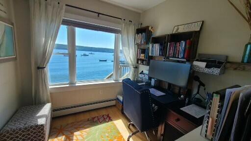 20 Wharf Rd, Blue Hill, ME 04614 - office area with a baseboard heating unit and wood finished floors