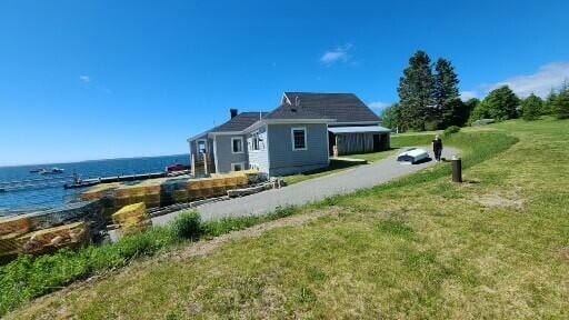 20 Wharf Rd, Blue Hill, ME 04614 - back of house with a water view and a lawn