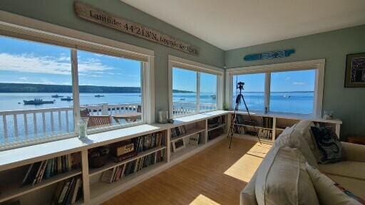 20 Wharf Rd, Blue Hill, ME 04614 - sunroom / solarium with a water view and wood finished floors