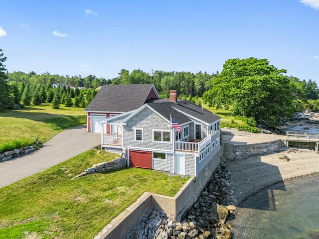 20 Wharf Rd, Blue Hill, ME 04614 - view of front of house featuring a front lawn, a chimney, and roof with shingles