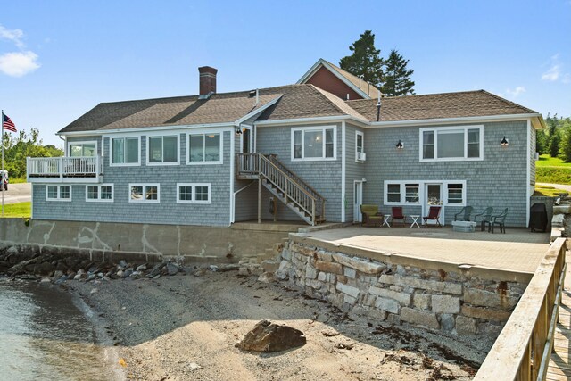 20 Wharf Rd, Blue Hill, ME 04614 - back of house with a chimney, roof with shingles, and a patio