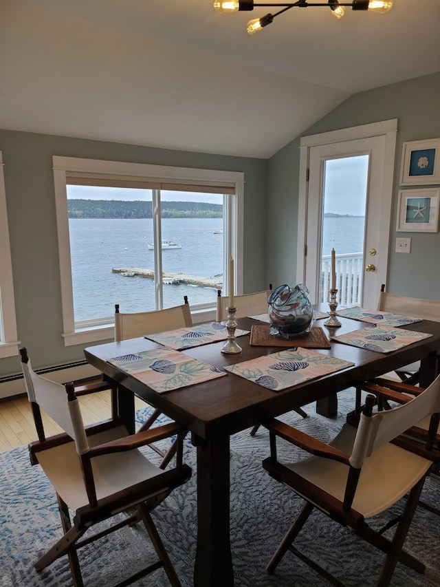 20 Wharf Rd, Blue Hill, ME 04614 - dining area featuring vaulted ceiling, healthy amount of natural light, a water view, and light wood-type flooring