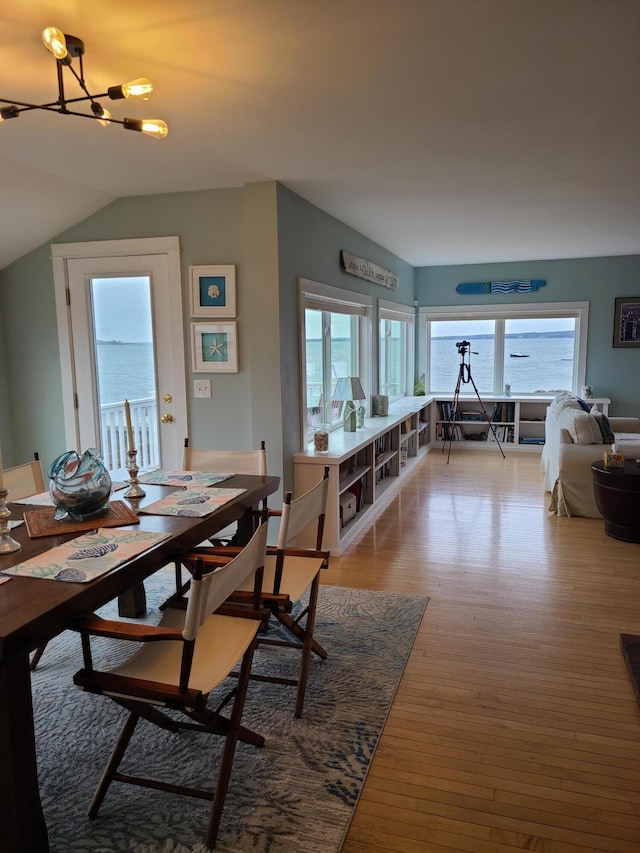 20 Wharf Rd, Blue Hill, ME 04614 - dining area with plenty of natural light, a chandelier, light wood-type flooring, and vaulted ceiling
