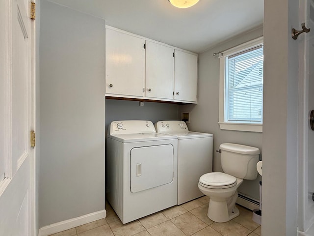 washroom featuring light tile patterned flooring, independent washer and dryer, baseboards, and a baseboard radiator