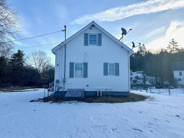 view of snow covered house