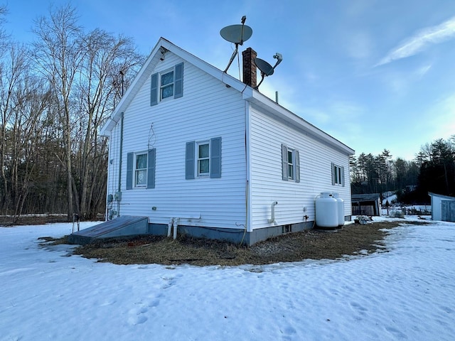 view of snow covered house