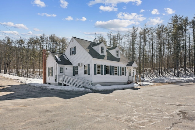 view of front facade with a shingled roof