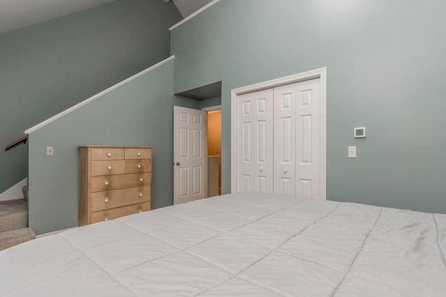 bedroom featuring a closet and a towering ceiling