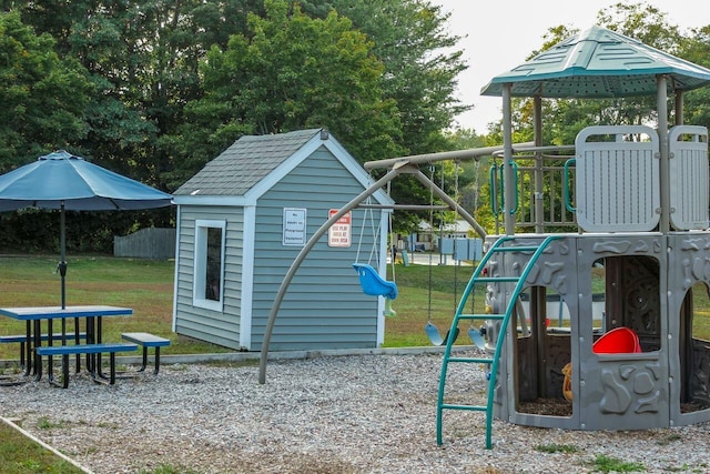 community jungle gym with a yard