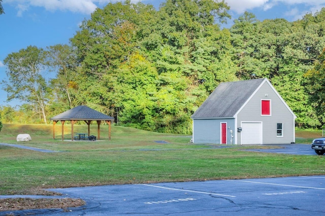 view of yard with a gazebo and an outdoor structure