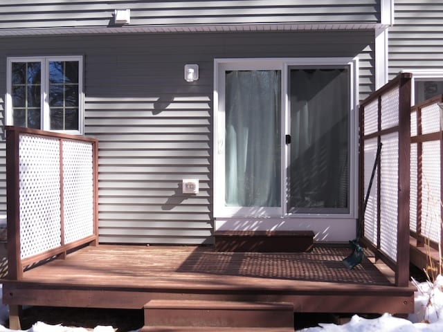 entrance to property featuring a deck