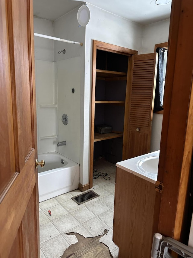 full bath with tile patterned floors, visible vents, vanity, and shower / bathtub combination