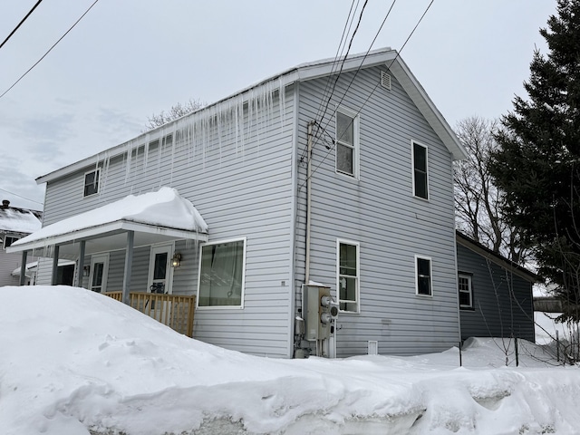 view of snow covered house