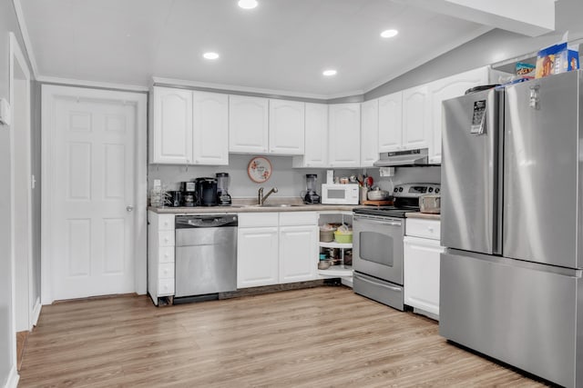 kitchen with a sink, white cabinets, under cabinet range hood, appliances with stainless steel finishes, and light wood-type flooring