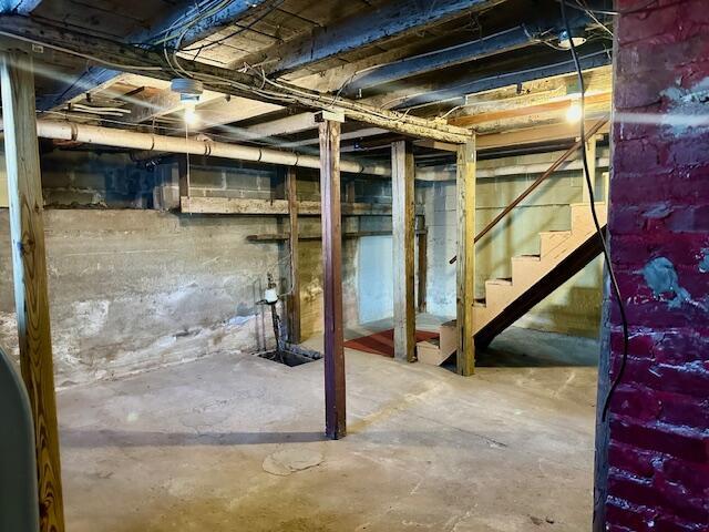 unfinished basement with stairway