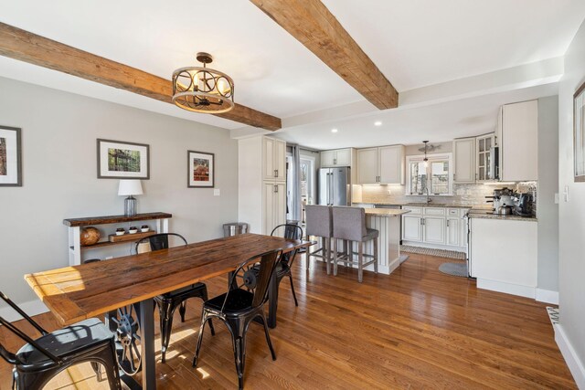 dining area featuring recessed lighting, beamed ceiling, baseboards, and dark wood-type flooring