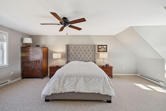 bedroom with baseboard heating, carpet flooring, and baseboards