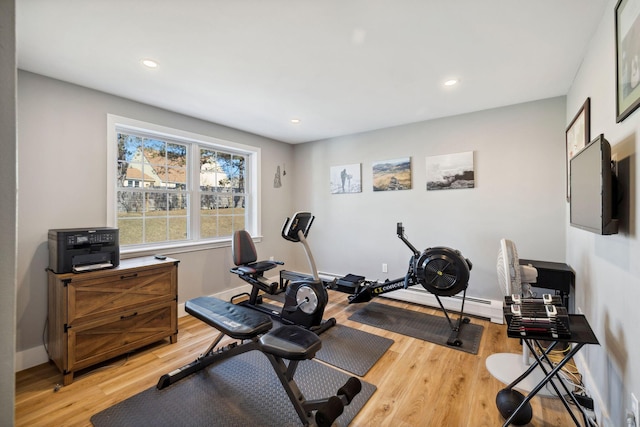 workout area with light wood-style flooring, recessed lighting, and baseboards