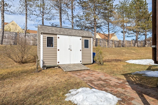 view of shed with a fenced backyard