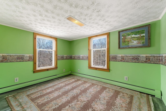 unfurnished room with crown molding, a healthy amount of sunlight, wainscoting, and a textured ceiling