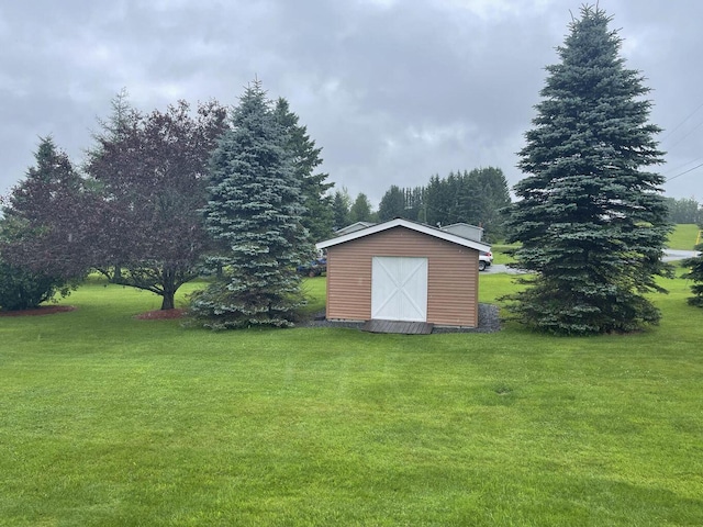 view of yard with an outbuilding and a shed