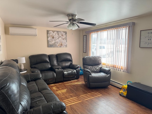 living area featuring a wall mounted air conditioner, baseboard heating, wood finished floors, and ceiling fan