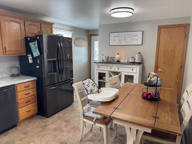 kitchen with black appliances and brown cabinets